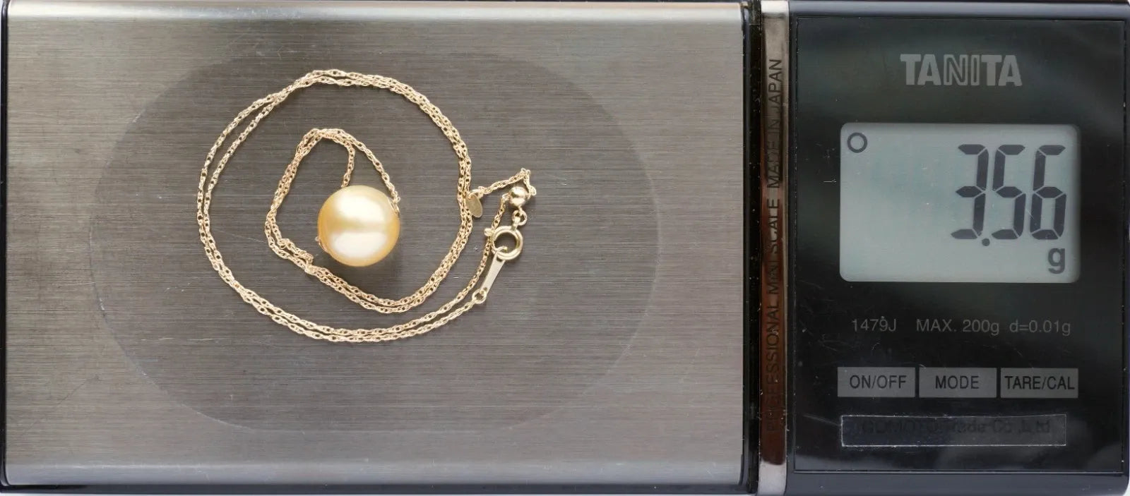 Collier pendentif perles dorées mer du Sud 11,6 mm en or jaune 18 carats, rég...